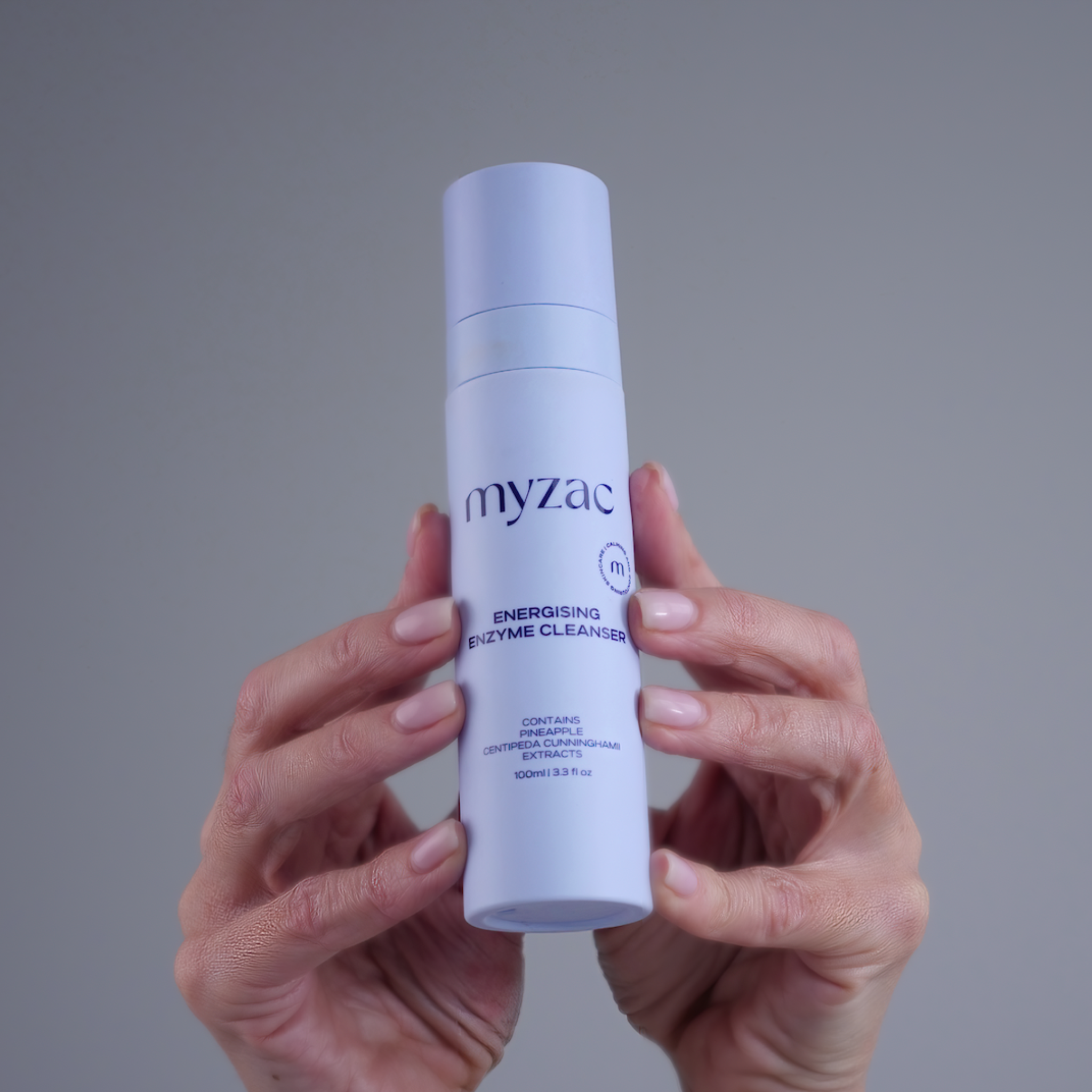 Hands holding MYZAC Gentle Botanical Gel Cleanser
