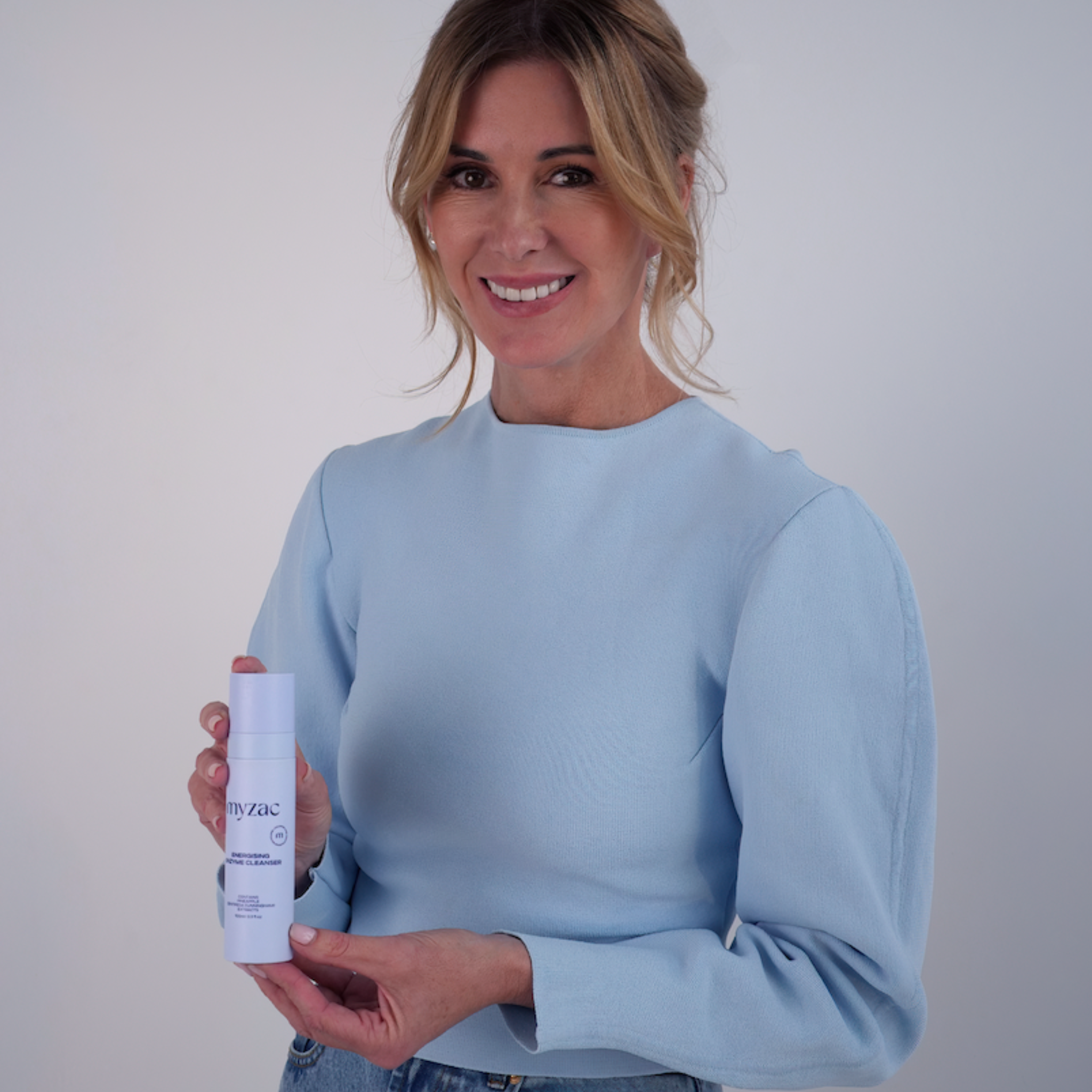 Model holding MYZAC Gentle Botanical Gel Cleanser